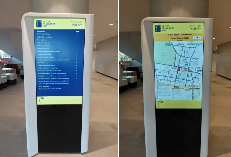 Digital directory boards and a map at the Health Translation Hub